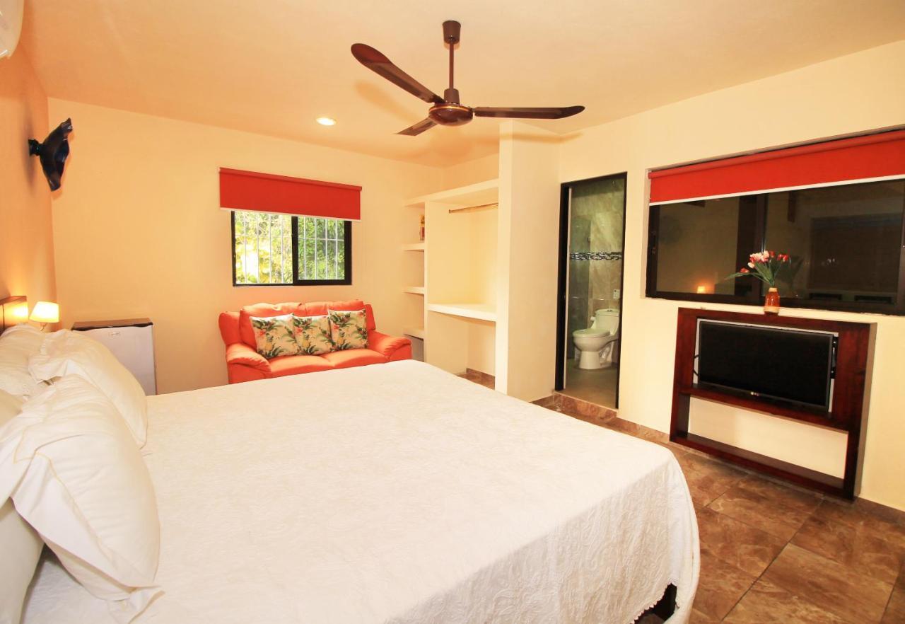 Papagayo Hotel Boutique Playa del Carmen Exterior foto A bedroom at the hotel