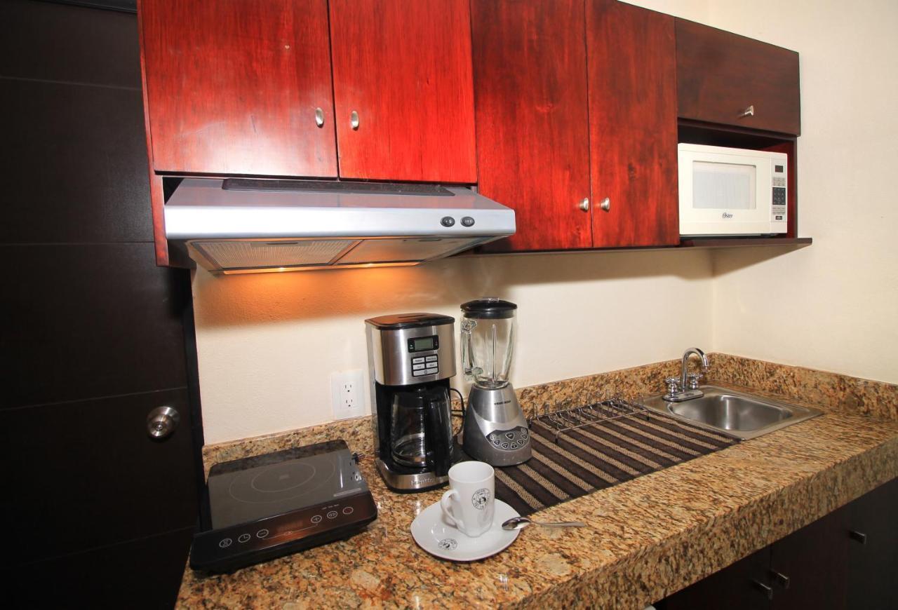 Papagayo Hotel Boutique Playa del Carmen Exterior foto A coffeemaker in a kitchen