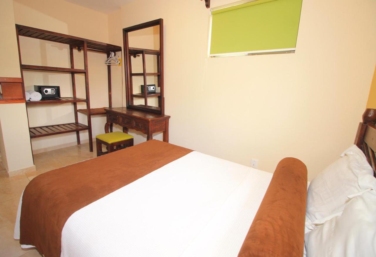 Papagayo Hotel Boutique Playa del Carmen Exterior foto A bedroom at the hotel