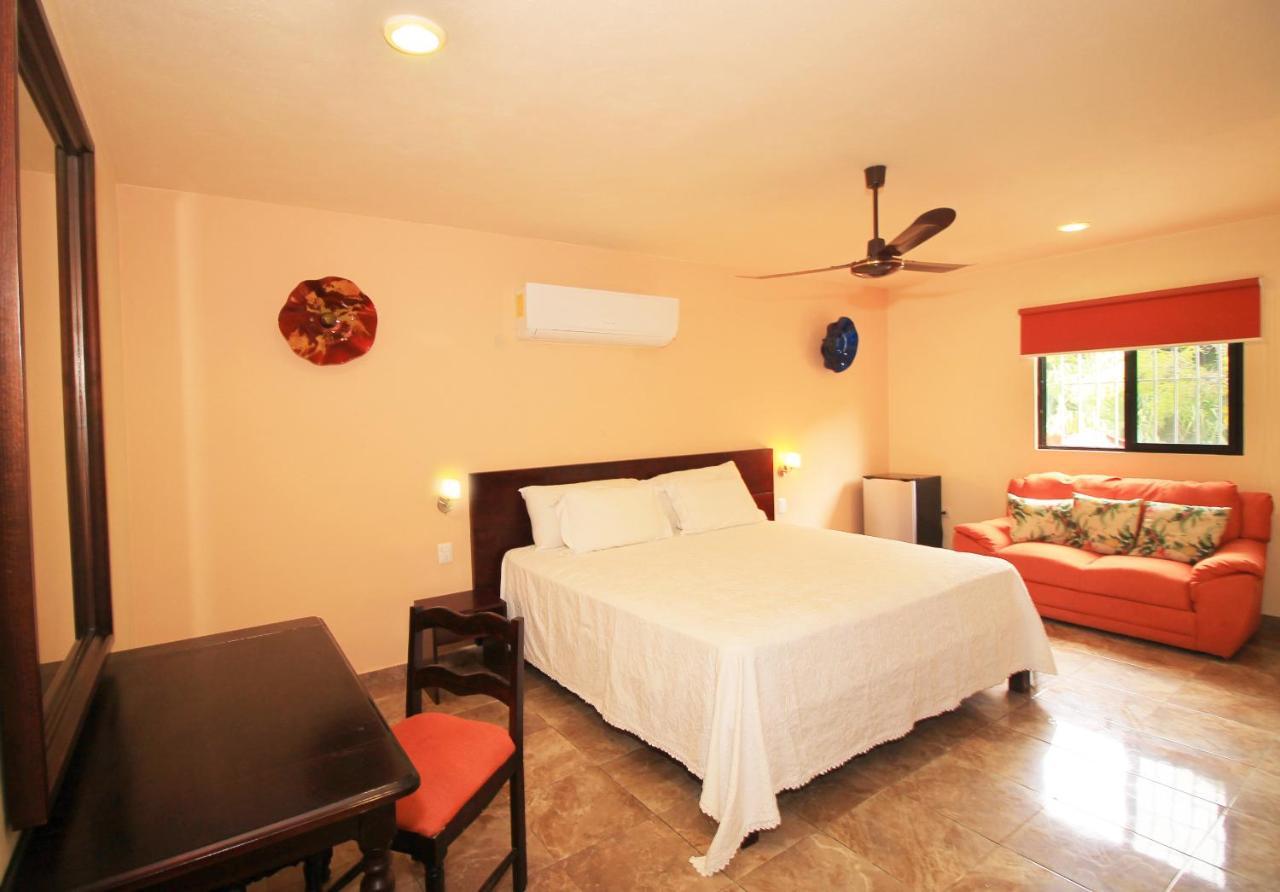 Papagayo Hotel Boutique Playa del Carmen Exterior foto A bedroom at the hotel